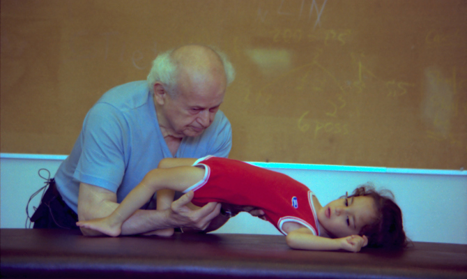 Moshé Feldenkrais and child Amherst 1981