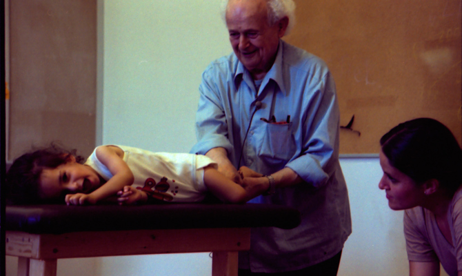 Moshé Feldenkrais and child Amherst 1981