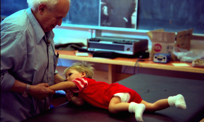 Moshé Feldenkrais and child Amherst 1981
